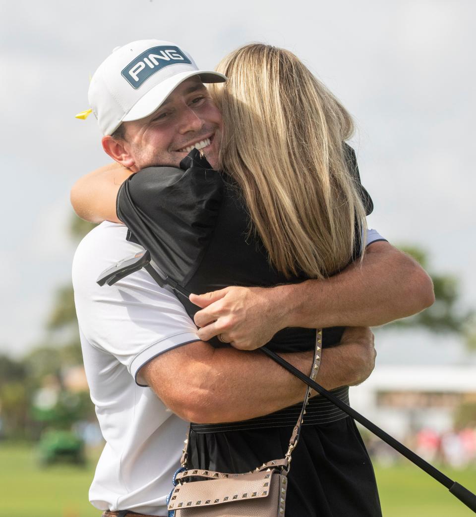 Austin Eckroat hugs his wife Sally after winning he Cognizant Classic in The Palm Beaches at PGA National Resort & Spa on March 4, 2024 in Palm Beach Gardens, Florida.