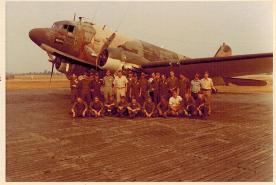The writer’s father, Michael Moore, in the blue shirt in the back row, with his squadron at a U.S. military base in Thailand in 1973. He was a fellow pilot in the Baron 52 squadron but was on leave when the flight was shot down that Feb. 4.