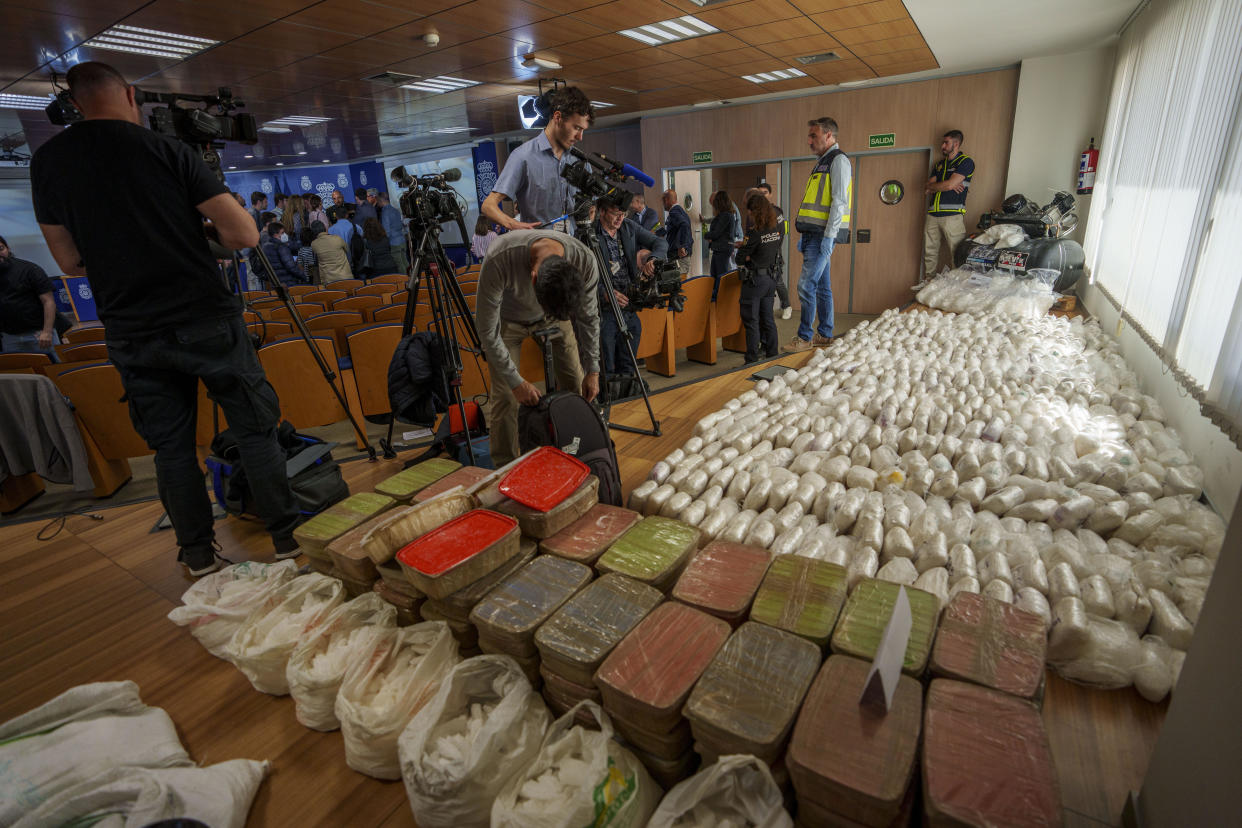 Police officers and journalists stand by part of a haul of 1.8 tons of methamphetamine in Madrid, Spain, Thursday, May 16, 2024. Spanish police say they have dismantled a major methamphetamine distribution network of the Mexican Sinaloa cartel. / Credit: Manu Fernandez / AP