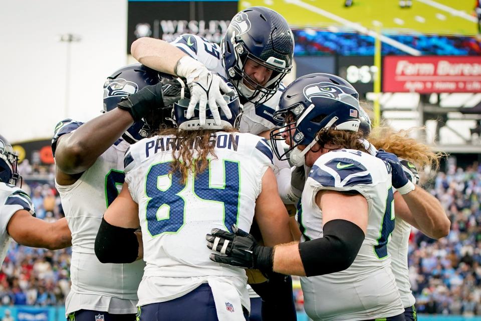 Seattle Seahawks tight end Colby Parkinson (84) celebrates his touchdown against the Tennessee Titans during the fourth quarter at Nissan Stadium in Nashville, Tenn., Sunday, Dec. 24, 2023.