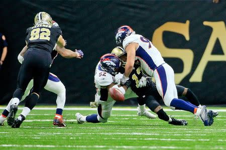 Nov 13, 2016; New Orleans, LA, USA; Denver Broncos inside linebacker Corey Nelson (52) and defensive end Jared Crick (93) force a fumble by New Orleans Saints wide receiver Michael Thomas (13) during the fourth quarter of a game at the Mercedes-Benz Superdome. The Broncos defeated the Saints 25-23. Mandatory Credit: Derick E. Hingle-USA TODAY Sports