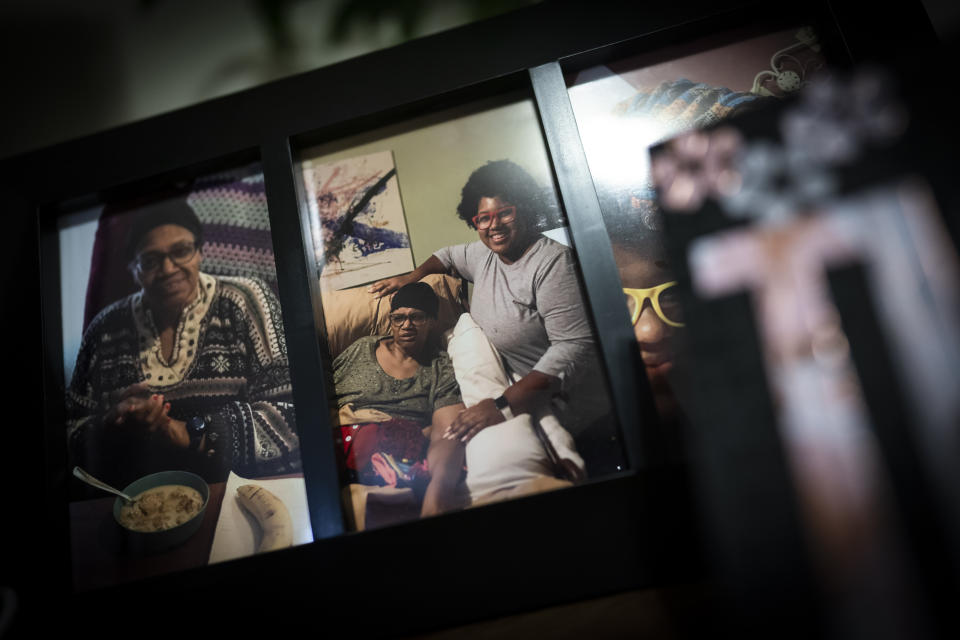 Photographs of mother and daughter, Constance and Jessica Guthrie, decorate a bedroom, in Fredericksburg, Va., on Monday, Sept. 19, 2022. While some risk factors for Alzheimer’s may differ by race, the large disparities among racial groups can’t be explained just by genetics. (AP Photo/Wong Maye-E)