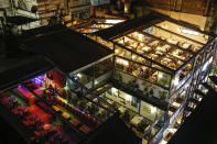 A view of restaurants, some with diners, others with many empty tables, near Taksim Square in Istanbul, Friday, Oct. 23, 2020. In much of Europe, city squares and streets, be they wide, elegant boulevards like in Paris or cobblestoned alleys in Rome, serve as animated evening extensions of drawing rooms and living rooms. As Coronavirus restrictions once again put limitations on how we live and socialize, AP photographers across Europe delivered a snapshot of how Friday evening, the gateway to the weekend, looks and feels. (AP Photo/Emrah Gurel)