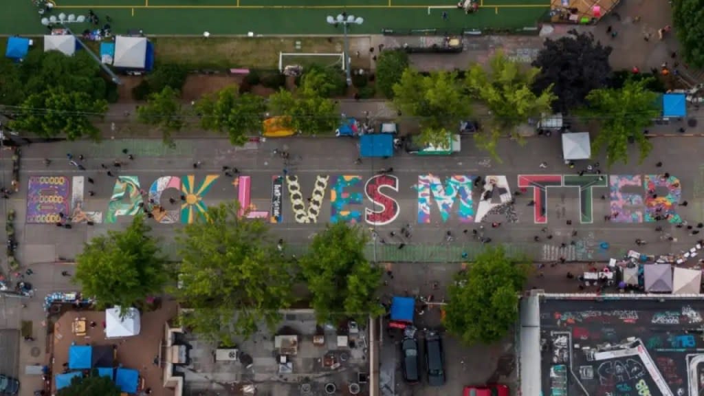 An aerial view of a Black Lives Matter mural on East Pine Street near Cal Anderson Park is seen during June 2020 Black Lives Matter events in Seattle, Washington. A community garden originally planted in Cal Anderson Park as part of those protests has been removed due to what the city described as unsafe conditions. (Photo by David Ryder/Getty Images)