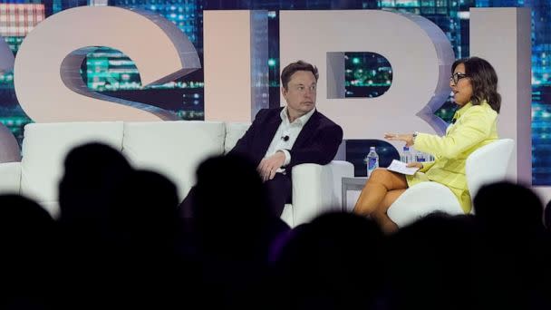 PHOTO: Twitter CEO Elon Musk, center, speaks with Linda Yaccarino, chairman of global advertising and partnerships for NBC, at the POSSIBLE marketing conference, April 18, 2023, in Miami Beach, Fla. (Rebecca Blackwell/AP, FILE)