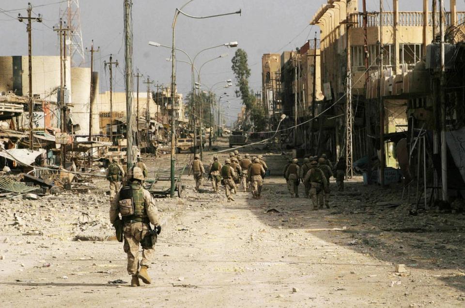 <div class="inline-image__caption"><p>A picture released Nov. 23, 2004, by the Multi National Force-Iraq shows members of the Iraqi Special Force (ISF) patrolling along with Marines in the devastated city of Fallujah. </p></div> <div class="inline-image__credit">MNF-I/AFP via Getty Images</div>