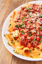 <p>We love a hearty meat sauce for topping our <a href="https://www.delish.com/uk/cooking/recipes/a30207172/easy-crockpot-spaghetti-recipe/" rel="nofollow noopener" target="_blank" data-ylk="slk:spaghetti;elm:context_link;itc:0;sec:content-canvas" class="link ">spaghetti</a> or pappardelle. Lamb changes things up a bit and is even more tender than <a href="https://www.delish.com/uk/beef-recipes/" rel="nofollow noopener" target="_blank" data-ylk="slk:beef;elm:context_link;itc:0;sec:content-canvas" class="link ">beef</a>. This ragù is perfect for making a big batch on Sunday night and freezing any leftovers for when your pasta craving hits—which I'm sure will be soon!</p><p>Get the <a href="https://www.delish.com/uk/cooking/recipes/a30510748/lamb-ragu-recipe/" rel="nofollow noopener" target="_blank" data-ylk="slk:Lamb Ragu;elm:context_link;itc:0;sec:content-canvas" class="link ">Lamb Ragu</a> recipe.</p>