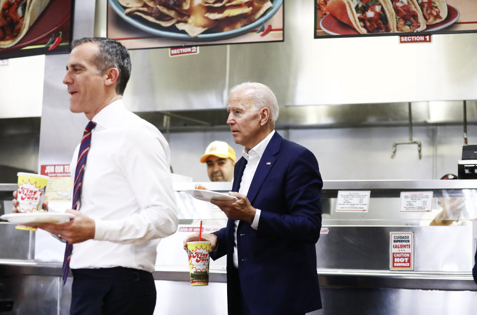 Former Vice President Joe Biden eats tacos with Los Angeles Mayor Eric Garcetti in Los Angeles on May 8.