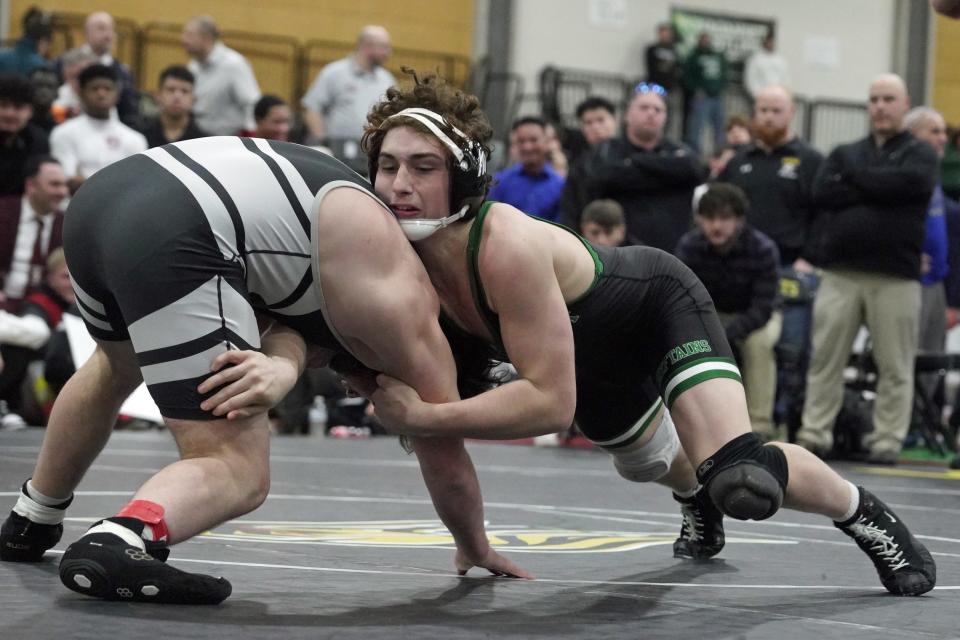 Ponaganset's Preston Marchesseault battles Trevor O'Connor, of Pilgrim, at the state wrestling meet.