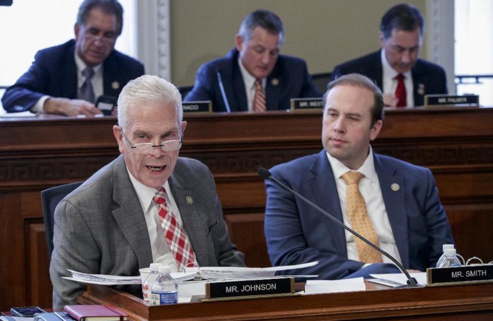 Rep. Bill Johnson, R-Ohio, left, and Rep. Jason Smith, R-Mo., work on the Republican health care bill in the House Budget Committee on Capitol Hill in Washington, Thursday, March, 16, 2017. (AP Photo/J. Scott Applewhite)