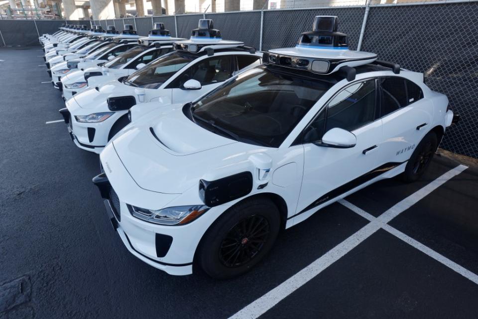 A fleet of parked Waymo cars is seen above in San Francisco. The Google-owned firm will be participating in New York City’s pilot testing program. REUTERS