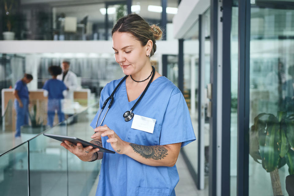 nurse using a tablet