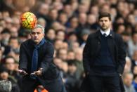 Chelsea's Portuguese manager Jose Mourinho (L) catches the ball during the match against Tottenham on November 29, 2015