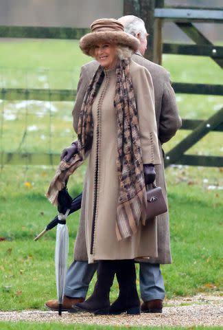 <p>Max Mumby/Indigo/Getty</p> King Charles and Queen Camilla walk from St Mary Magdalene near Sandringham House on Dec. 3.