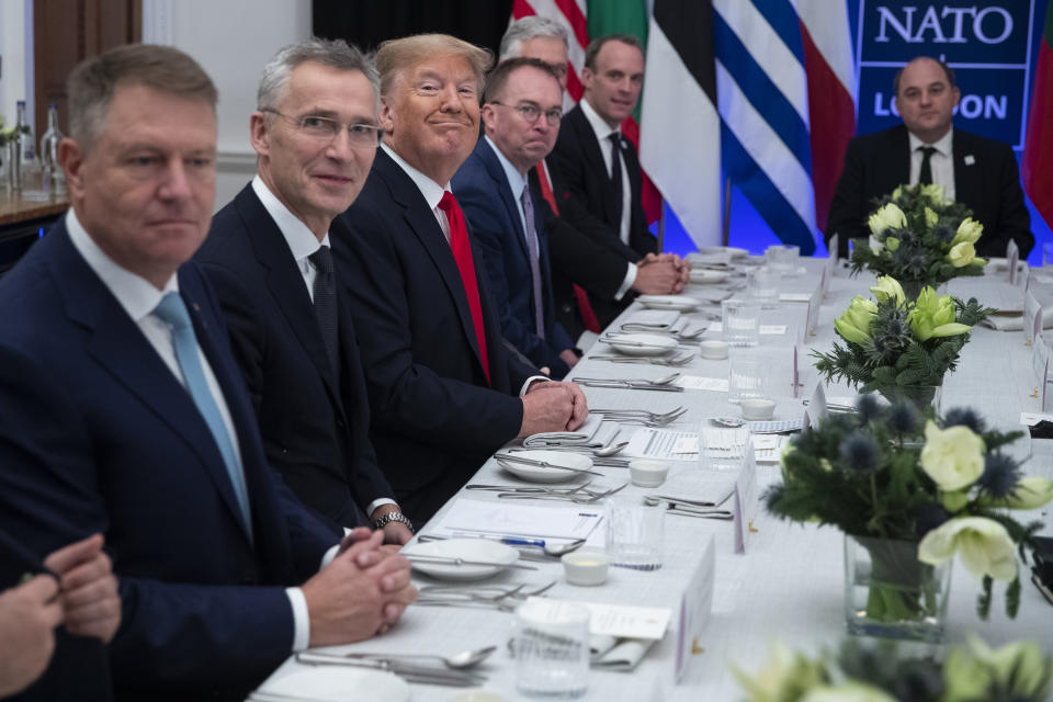 President Donald Trump smiles during a working lunch with NATO members that have met their financial commitments to the the organization, at The Grove, Wednesday, Dec. 4, 2019, in Watford, England. (AP Photo/ Evan Vucci)