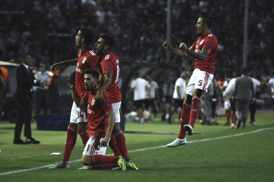 Benfica's players celebrate their sides second goal against PAOK during the Champions League playoffs, second leg, soccer match between PAOK and Benfica at theToumba stadium in the northern Greek port city of Thessaloniki, on Wednesday, Aug. 29, 2018. (AP Photo/Giannis Papanikos)