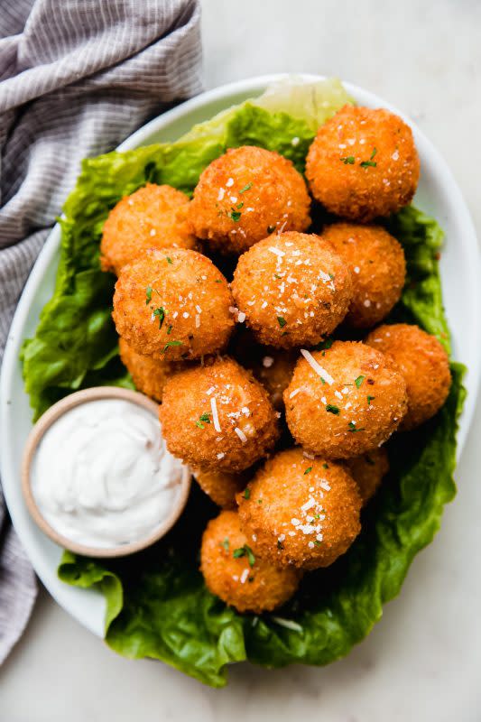 <p>Little Spice Jar</p><p>Mashed potato balls are the perfect way to use up leftovers from Thanksgiving! They’re loaded with cheddar cheese, parmesan, garlic, chives and spices, and coated with crunchy panko. This is the perfect way to use up those mashed potatoes for a crispy snack or appetizer! </p><p><strong>Get the recipe: <a href="http://www.littlespicejar.com/loaded-mashed-potato-balls/" rel="nofollow noopener" target="_blank" data-ylk="slk:Loaded Mashed Potato Balls;elm:context_link;itc:0;sec:content-canvas" class="link rapid-noclick-resp">Loaded Mashed Potato Balls</a></strong></p>