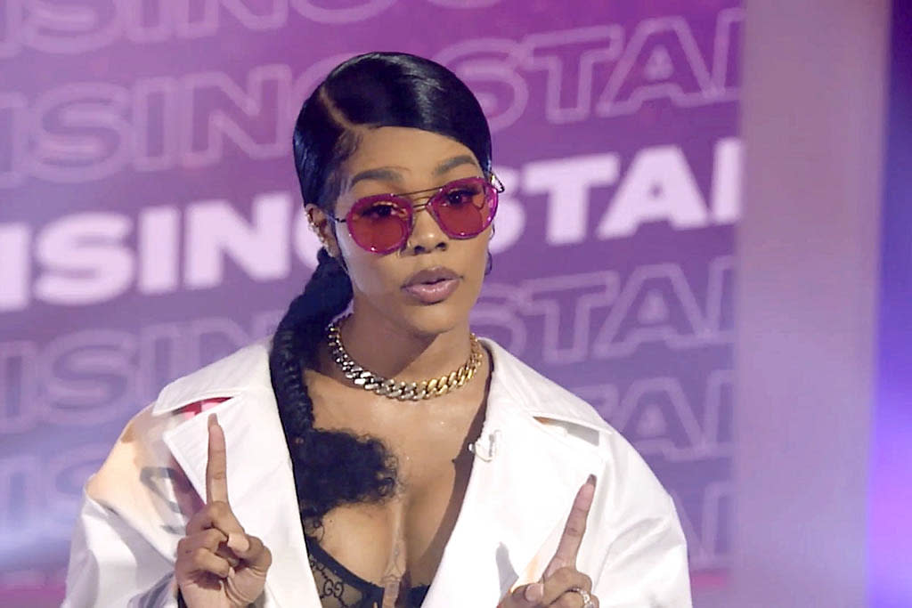 Teyana Taylor Shows How to Style Trench Coats in Patent Leather Thigh ...