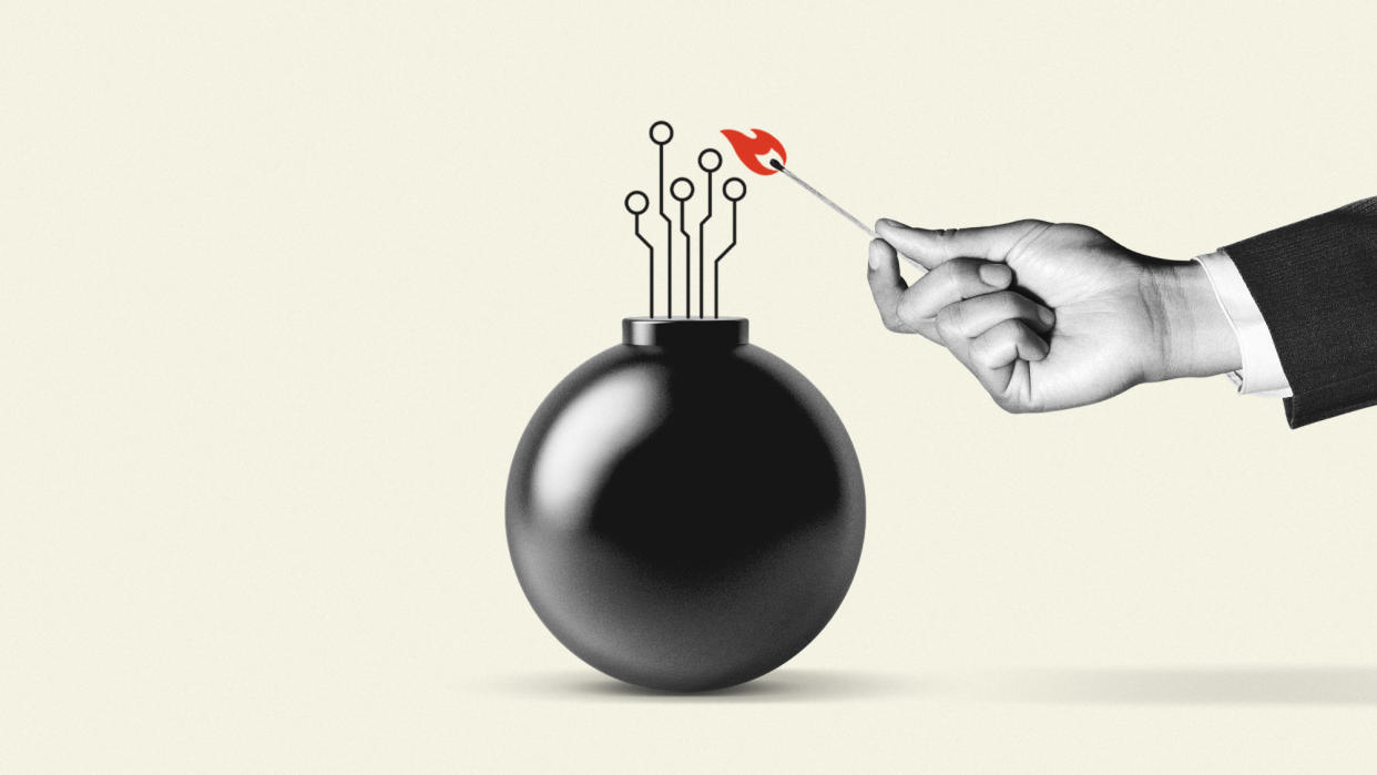  Hand with a match lighting a bomb. 