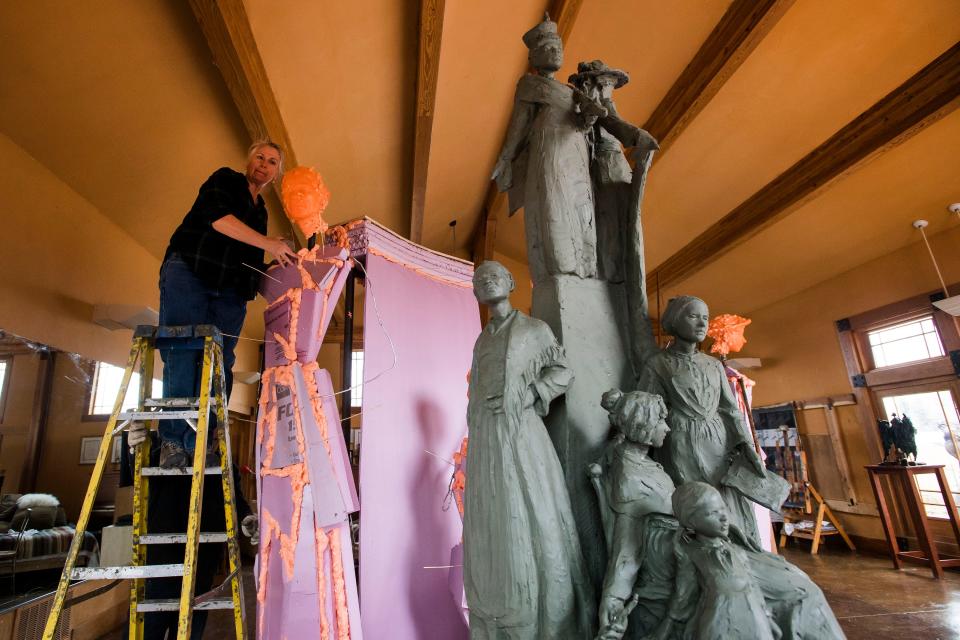 Sculptor Jane DeDecker works on building out the foam and metal structure that will eventually have clay sculpted on top of it of her piece "Every Word We Utter" on Friday, March 29, 2019, at her studio in Loveland, Colo. 