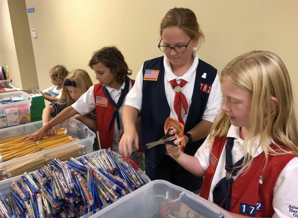 At Second Branch Baptist Church from left to right, Martina Sapone [5], Tilly Hart [6], Josephine Sapone [9], Ruby Hart [10] and Maizy Hart [8] pack school supply kits for Operation Christmas Child shoebox gifts.