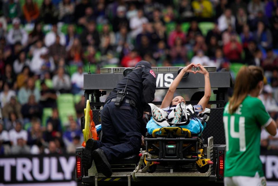 USWNT forward Mallory Swanson is taken off the field by medical personnel during a game against Ireland.