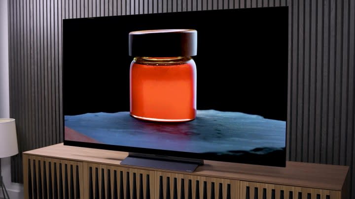 A backlit jar of amber liquid displayed on an LG C3 OLED.