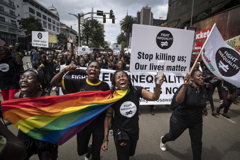 FILE - In this Friday, Jan. 17, 2020 file photo, demonstrators calling for an end to the "age of greed" and demanding fairer solutions to inequality, climate change, debt, taxation and other economic and human rights issues ahead of the World Economic Forum, march to the office of the president in downtown Nairobi, Kenya. African leaders in 2020 are asking what China can do for them as the coronavirus pandemic threatens to destroy economies across a continent where Beijing is both the top trading partner and top lender. (AP Photo/Ben Curtis, File)