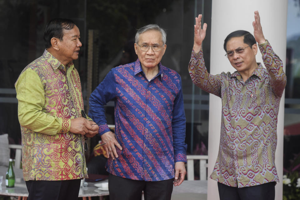 From left, Cambodia's Foreign Minister Prak Sokhonn, Thailand's Foreign Minister Don Pramudwinai and Lao's Foreign Minister Saleumxay Kommasith confer as they attend the Association of Southeast Asian Nations (ASEAN) Foreign Ministers' Meeting ahead of the 42nd ASEAN Summit in Labuan Bajo, East Nusa Tenggara, Indonesia, Tuesday, May 9, 2023. (Rivan Awal Lingga/Pool Photo via AP)