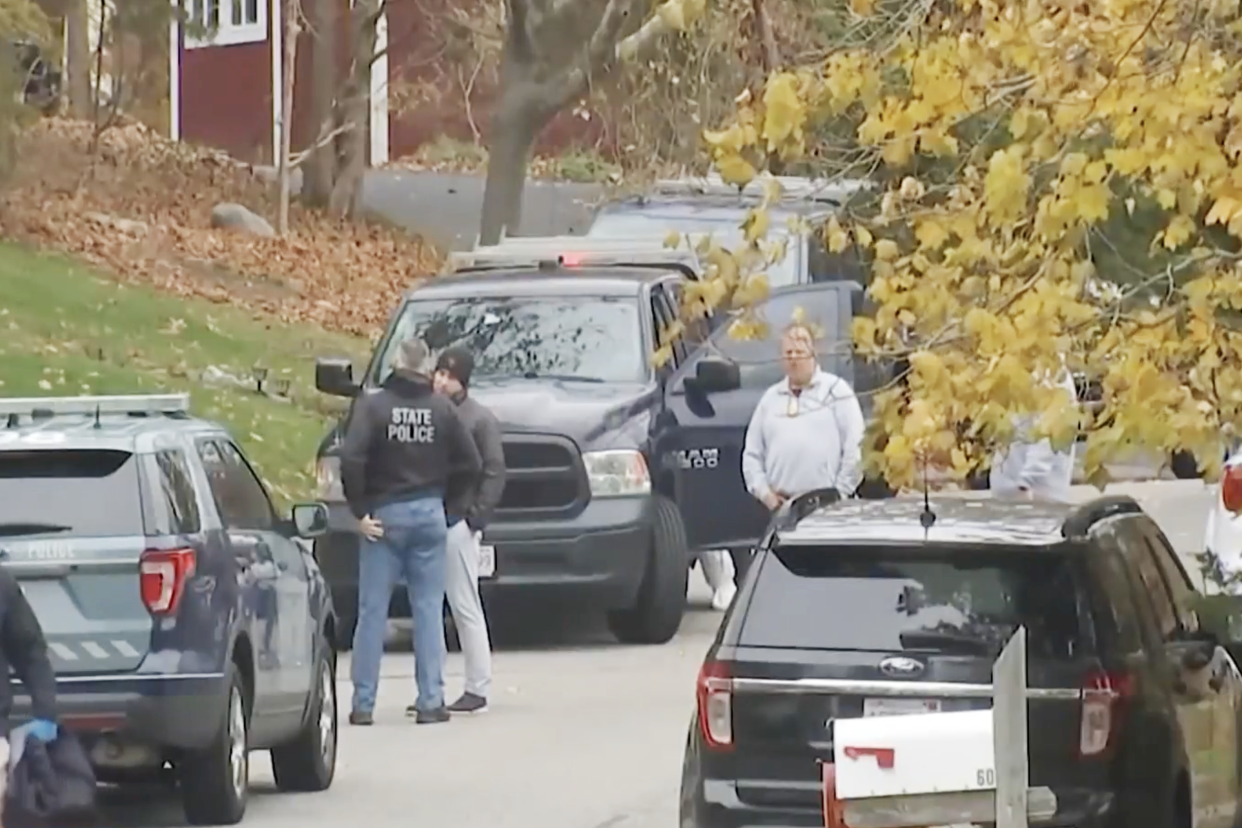 Officers near the scene of the double murder in Marshfield, Mass., on Wednesday.  (NBC10 Boston)