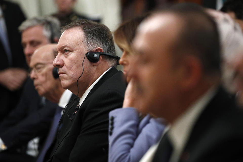 Secretary of State Mike Pompeo listens as President Donald Trump speaks at a news conference with Turkish President Recep Tayyip Erdogan in the East Room of the White House, Wednesday, Nov. 13, 2019, in Washington. (AP Photo/Patrick Semansky)