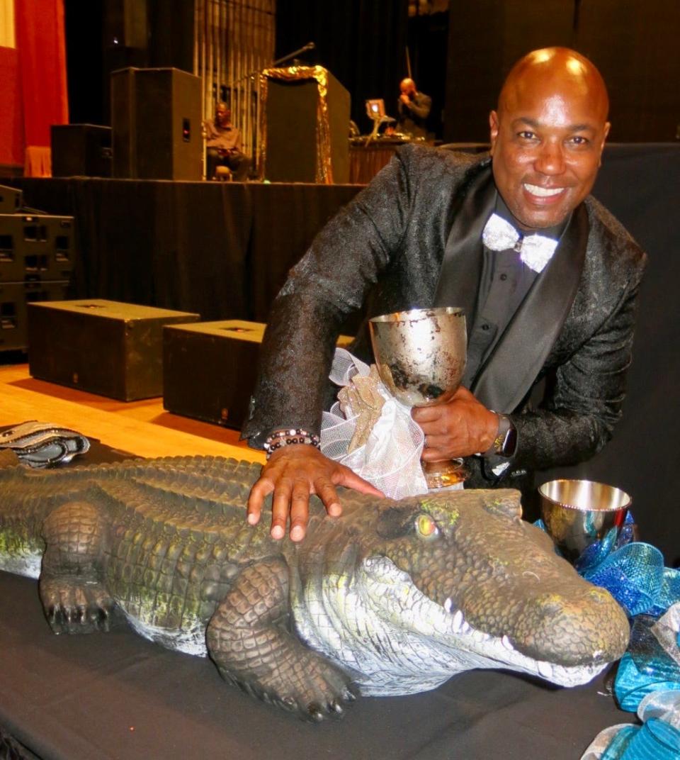 Outgoing Sobek captain Johann Cooke with the Krewe's symbol and "mascot" Croc-E-Dile on September 9, 2023.