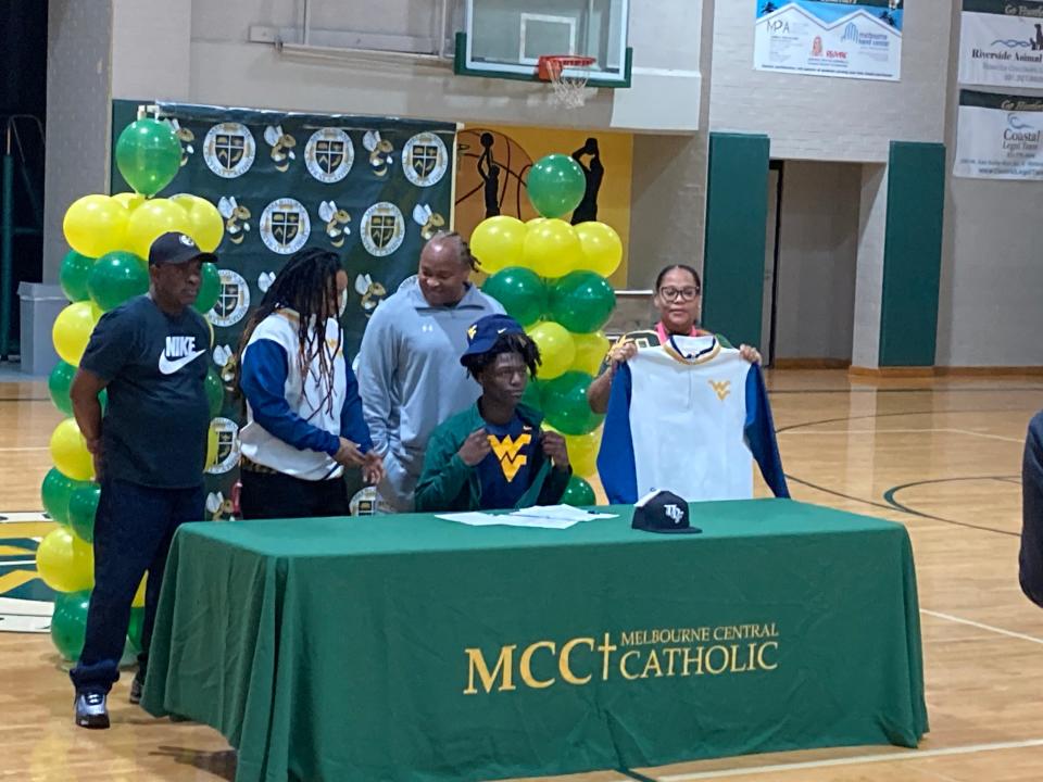 MCC to West Virginia receiver DayDay Farmer is joined by family and head coach Nate Hooks after signing on Wed., Dec. 20, 2023.