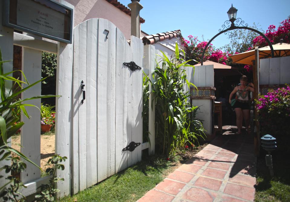 A small brick passageway leads to the restaurant, FARM, in the La Plaza area of Palm Springs.