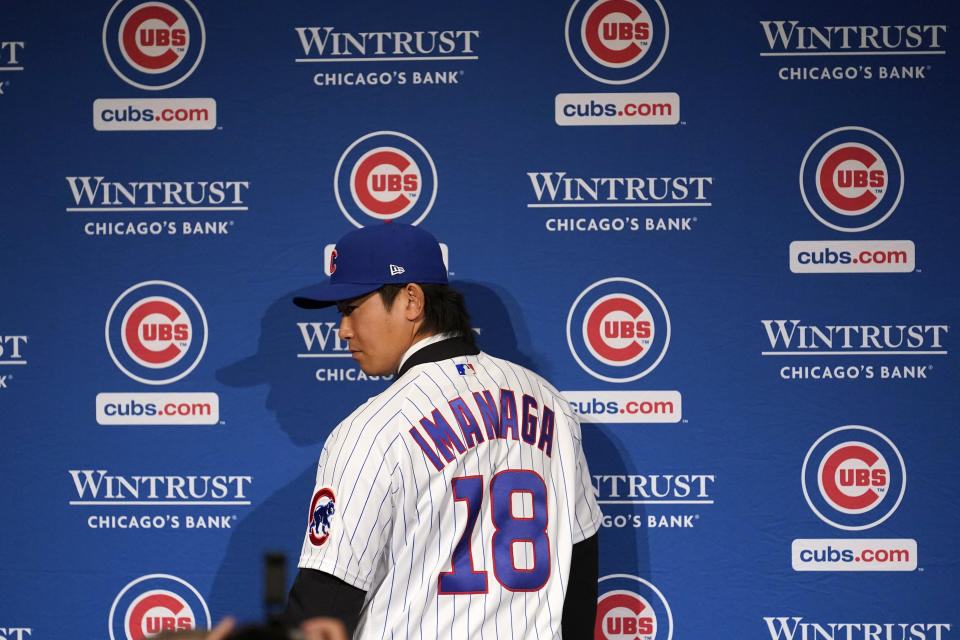 New Chicago Cubs pitcher Shōta Imanaga poses with his jersey during a news conference Friday, Jan. 12, 2024, in Chicago. The Japanese left-hander is expected to step right into the baseball team's rotation as it tries to return to the playoffs for the first time since 2020. (AP Photo/Charles Rex Arbogast)