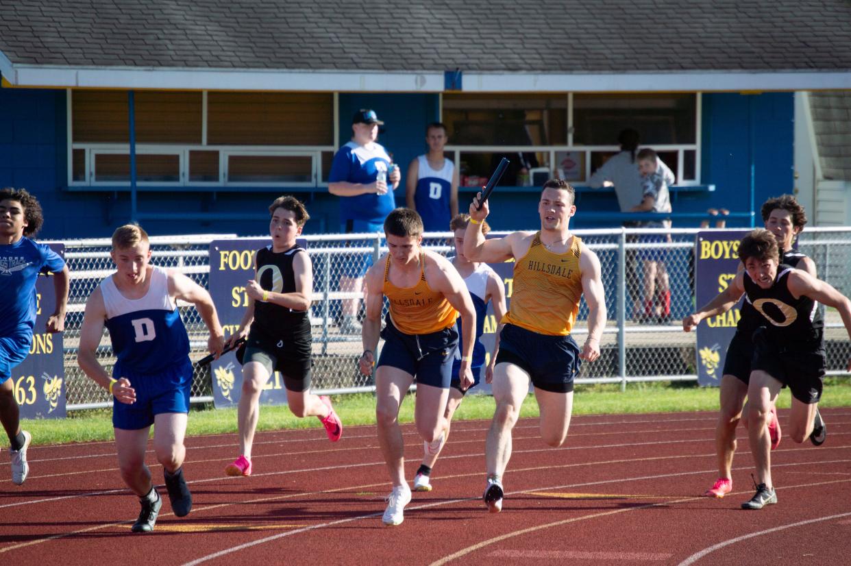Hillsdale 4x100 boys runners Stephen Petersen and Hunter Wilson build a significant lead in their race. The team is ranked fifth in D3 times.