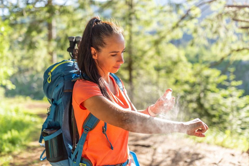 Applying a safe and effective insect repellent to your skin is a proven way to ward off mosquitoes and their bites. <a href="https://www.gettyimages.com/detail/photo/woman-applies-mosquito-spray-to-her-hands-during-royalty-free-image/1404334863" rel="nofollow noopener" target="_blank" data-ylk="slk:SimpleImages/Moment via Getty Images;elm:context_link;itc:0;sec:content-canvas" class="link ">SimpleImages/Moment via Getty Images</a>