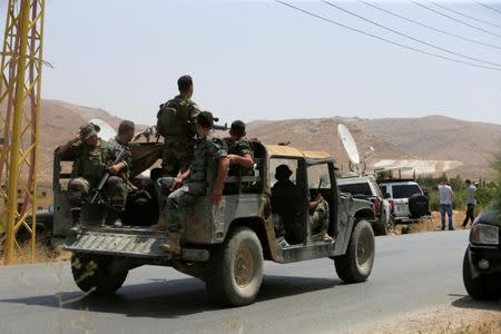 Lebanese army soldiers patrol a street in Labwe, at the entrance of the border town of Arsal, in eastern Bekaa Valley, Lebanon July 21, 2017. REUTERS/Ali Hashisho