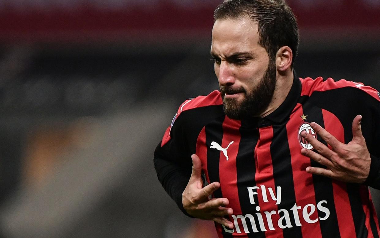 Gonzalo Higuain is currently on loan at AC Milan - AFP