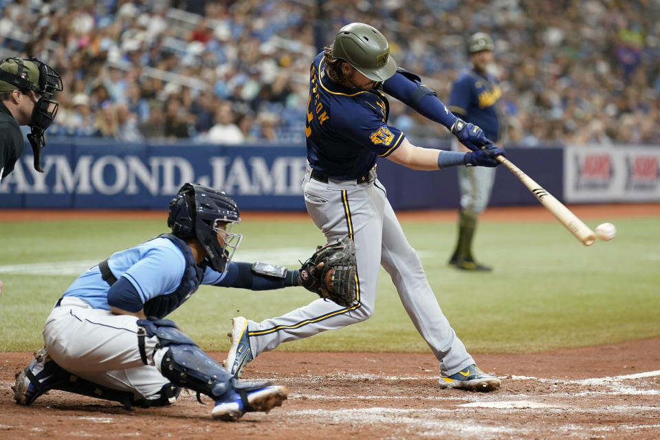 Milwaukee Brewers' Brian Anderson (9) lines an RBI single off Tampa Bay Rays' Cooper Criswell during the fifth inning of a baseball game Sunday, May 21, 2023, in St. Petersburg, Fla. Brewers Christian Yelich scored on the hit. Catching for Tampa Bay is Francisco Mejia. (AP Photo/Chris O'Meara)