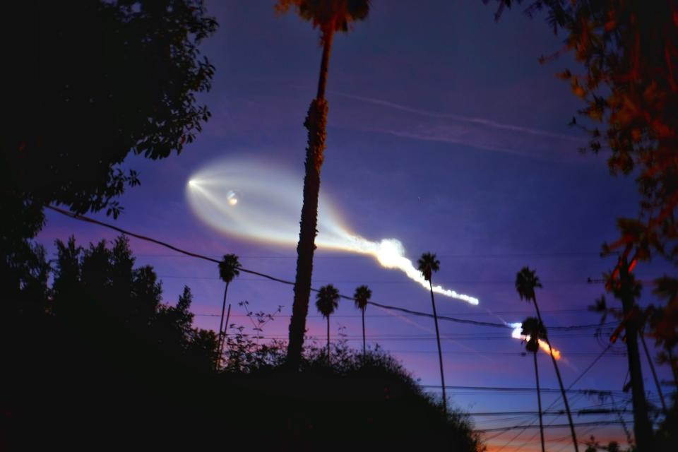 Photographer Erica Kelly Martin captured this amazing view of SpaceX's Falcon 9 rocket soaring over the palm trees of Hollywood, California after its launch from Vandenberg Air Force Base on Dec. 22, 2017. <cite><a href="http://www.ericakellymartin.com" rel="nofollow noopener" target="_blank" data-ylk="slk:Erica Kelly Martin;elm:context_link;itc:0;sec:content-canvas" class="link ">Erica Kelly Martin</a></cite>