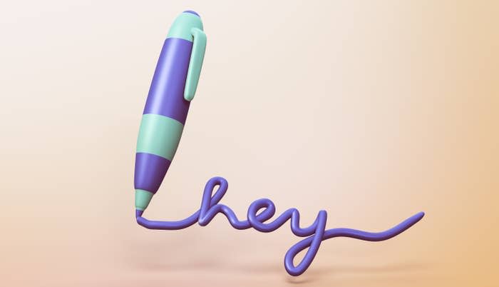 pen writing the word hey