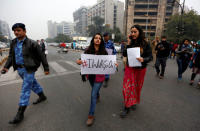 Women take part in the #IWillGoOut rally, organized to show solidarity with the Women's March in Washington, along a street in New Delhi, January 21, 2017. REUTERS/Cathal McNaughton