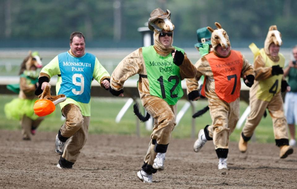 Participants in the New Jersey Irish Festival's Human Horse Race make a dash to the finish line in 2011.