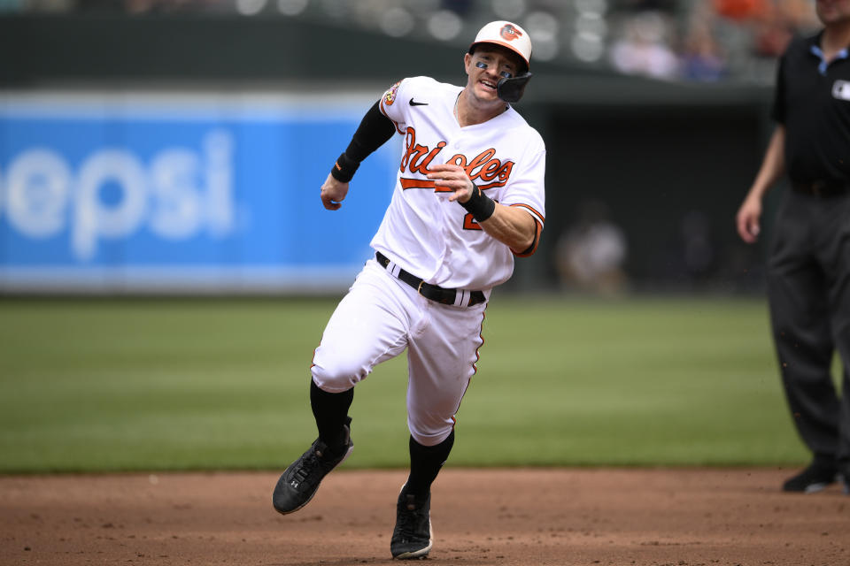 Baltimore Orioles' Austin Hays runs toward third for a triple during the third inning of a baseball game against the Texas Rangers, Sunday, May 28, 2023, in Baltimore. (AP Photo/Nick Wass)