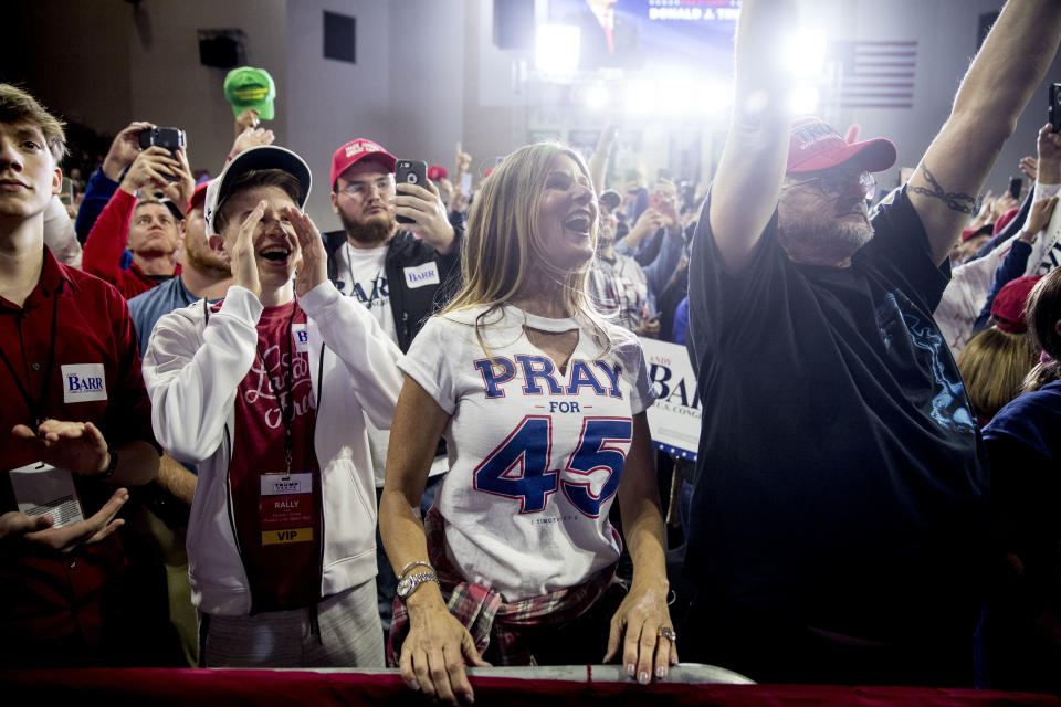 Audience members cheer as President Donald Trump takes the stage at a rally at Alumni Coliseum in Richmond, Ky., Saturday, Oct. 13, 2018. (AP Photo/Andrew Harnik)