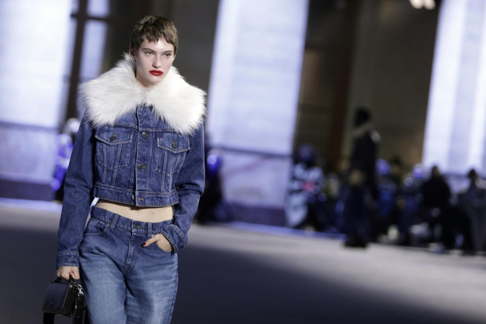 A model wears a creation by Alexandre Mattiussi for the Ami fall-winter 22/23 men's collection, in Paris, Wednesday, Jan. 19, 2022. (AP Photo/Lewis Joly)