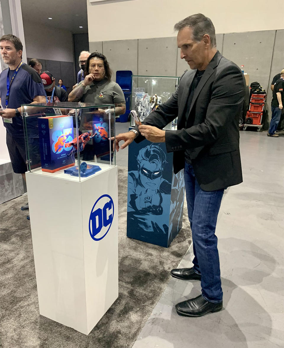 Todd McFarlane, creator of Spawn and head of McFarlane Toys, checks out the wares at the DC boot