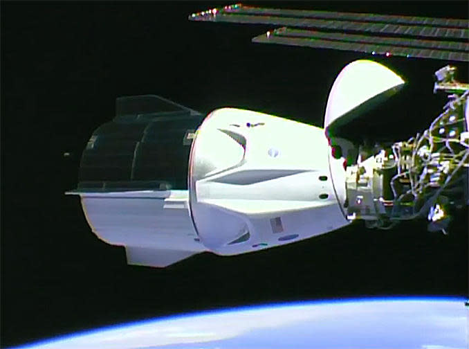 A camera on the International Space Station captured a view of the SpaceX Crew Dragon capsule after its autonomous docking at the lab's forward port on May 31.  / Credit: NASA