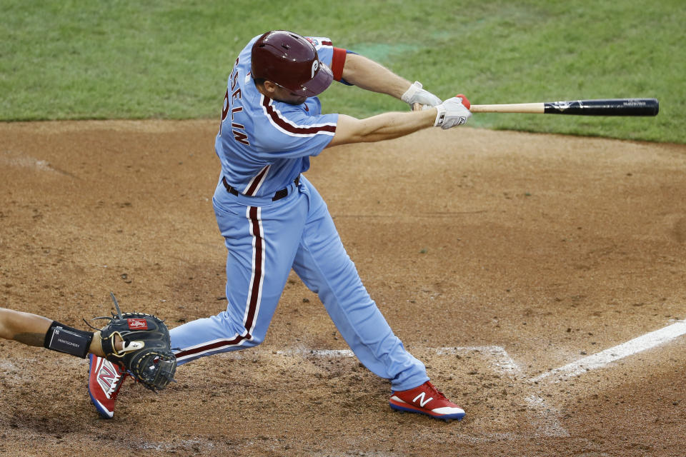 Philadelphia Phillies' Phil Gosselin follows through after hitting a two-run double off New York Yankees starting pitcher Jordan Montgomery during the third inning of a baseball game, Thursday, Aug. 6, 2020, in Philadelphia. (AP Photo/Matt Slocum)